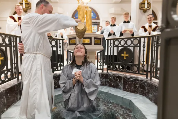 A baptism during the Rite of Christian Initiation at St. Mary’s Catholic Center in College Station, Texas. Credit: Courtesy of St. Mary’s Catholic Center