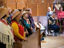 Members of the Sts’ailes First Nation at Holy Rosary Cathedral last year for the first Mass to integrate a First Nation language.  A Cardus report presents the voices of Indigenous Canadians speaking about their faith and distinguishing it from the traditional spirituality they’re often associated with.