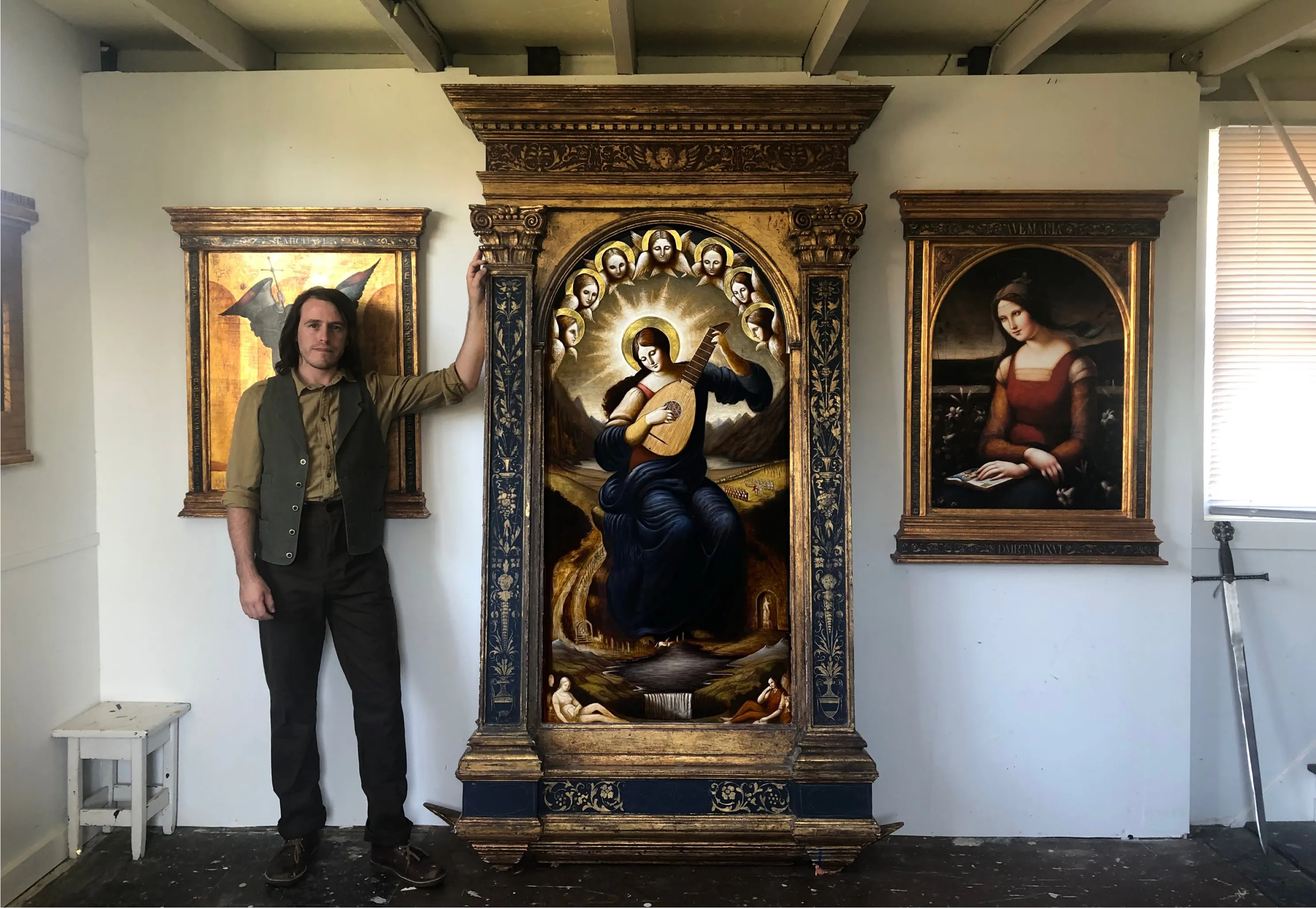 David Troncoso stands in his art studio with an altarpiece he recently completed.?w=200&h=150