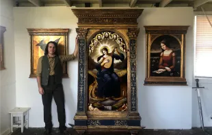David Troncoso stands in his art studio with an altarpiece he recently completed. Courtesy of David Troncoso.