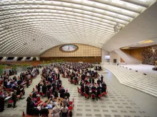 Synod on Synodality delegates seated at discussion tables inside Paul VI Hall at the Vatican in October 2023.