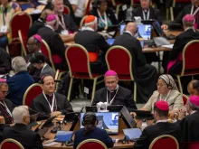 Synod on Synodality delegates in small groups listen to Pope Francis' guidance for the upcoming weeks on Oct. 4, 2023.