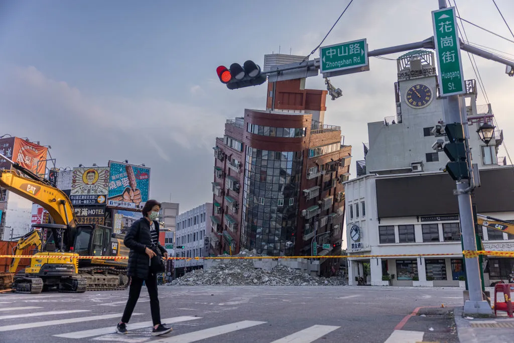 A person walks past an area of a damaged building that is cordoned off following a 7.5-magnitude earthquake on April 3, 2024, in Hualien, Taiwan.?w=200&h=150