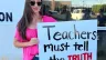 Jessica Tapia displays a sign outside the Garden Grove Unified School District board meeting on behalf of the Teachers Don’t Lie program.