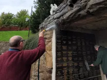 Carfin Grotto, Scotland’s national shrine to Our Lady of Lourdes, is cleaned after a suspected arson attack on Oct. 17, 2021.