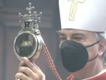 Archbishop Domenico Battaglia holds a reliquary containing St. Januarius’ liquefied blood in Naples Cathedral, Italy, Sept. 19, 2021.