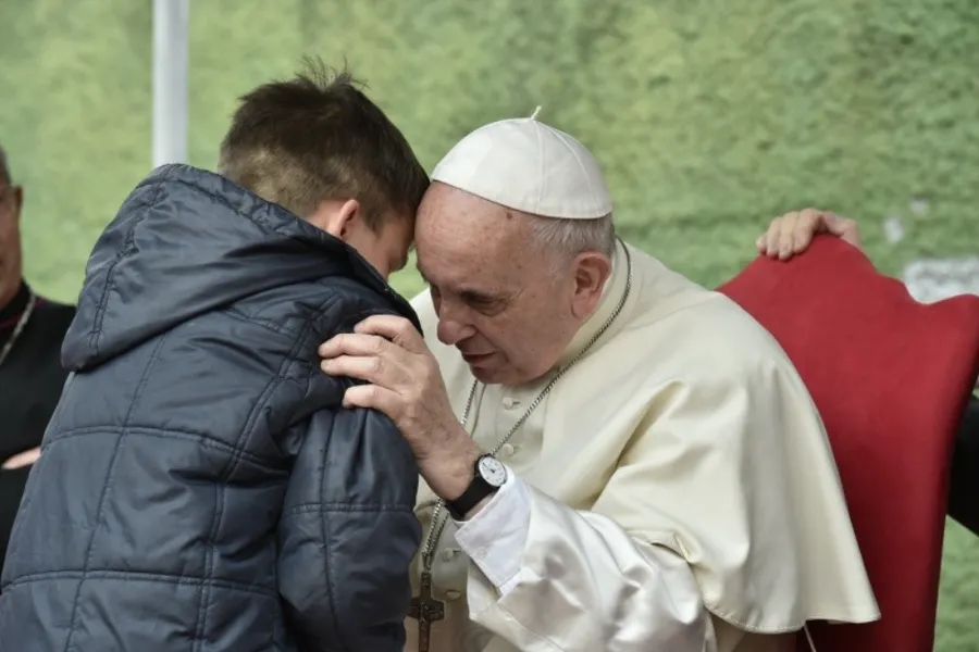 Pope Francis listens to a boy called Emanuele at St. Paul of the Cross parish, Rome, on April 15, 2018.?w=200&h=150