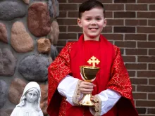 Teddy Howell, a Michigan third grader, dressed as a priest.