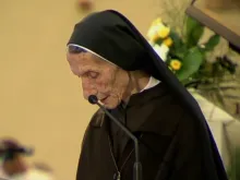 Pope Francis listens as Sister Marije Kaleta speaks in Tirana’s St. Paul Cathedral, Albania, Sunday, Sept. 21, 2014.