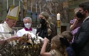 Pope Francis baptizes a child in the Sistine Chapel on Jan. 9, 2021. Screenshot from Vatican News YouTube channel.