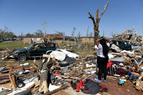 Kenterica Sardin, 23, looks on from her damaged home after a series of powerful storms and at least one tornado on March 25, 2023 in Rolling Fork, Mississippi. At least 26 people have reportedly been killed with dozens more injured following devastating storms across western Mississippi. Will Newton/Getty Images