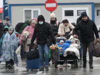Ukrainian refugees walk from Ukraine to Isaccea in Romania after crossing the border on March 2, 2022.