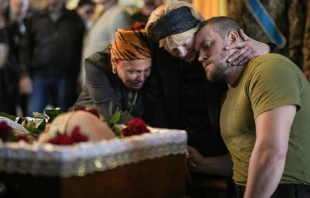 Relatives, friends and comrades of Ukrainian soldier Eduardo Trepilchenko, who was killed on the Eastern front battling the Russian invasion , attend his funeral at St Michael's Cathedral on May 25, 2022 in Kyiv, Ukraine. Christopher Furlong/Getty Images