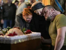 Relatives, friends and comrades of Ukrainian soldier Eduardo Trepilchenko, who was killed on the Eastern front battling the Russian invasion , attend his funeral at St Michael's Cathedral on May 25, 2022 in Kyiv, Ukraine.