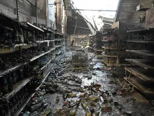 A photograph taken on June 28, 2022 shows charred goods in a grocery store of the destroyed Amstor mall in Kremenchuk, one day after it was hit by a Russian missile strike according to Ukrainian authorities.