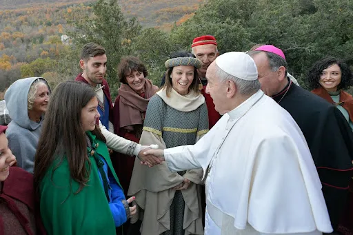 In Greccio in 2019, Pope Francis meets some of the performers of the historical representation of the first Nativity scene. Credit: Vatican Media