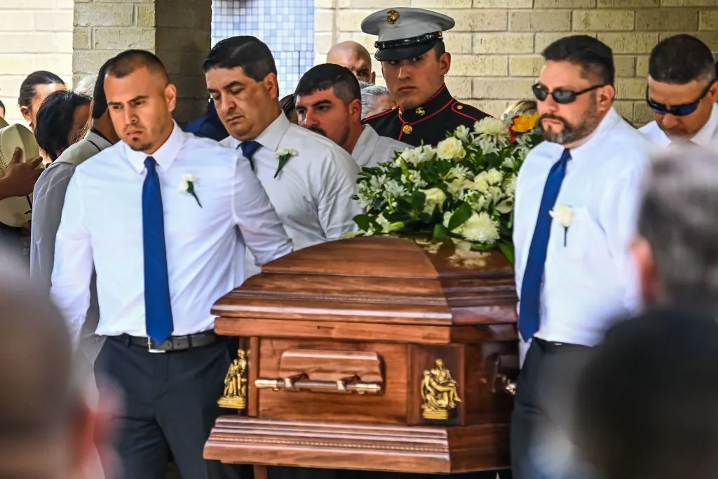 Pallbearers and U.S. Marine Christian Garcia, son of Linda Garcia, carry the casket of Irma Linda Garcia and her husband Jose Antonio Garcia during their funeral mass at Sacred Heart Catholic Church in Uvalde, Texas, on June 1, 2022. Irma Garcia, a teacher, was killed in a mass shooting at a local elementary school on May 24, 2022.?w=200&h=150
