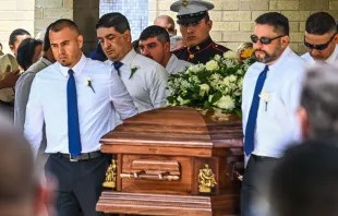 Pallbearers and U.S. Marine Christian Garcia, son of Linda Garcia, carry the casket of Irma Linda Garcia and her husband Jose Antonio Garcia during their funeral mass at Sacred Heart Catholic Church in Uvalde, Texas, on June 1, 2022. Irma Garcia, a teacher, was killed in a mass shooting at a local elementary school on May 24, 2022. Chandan Khanna/AFP via Getty Images.