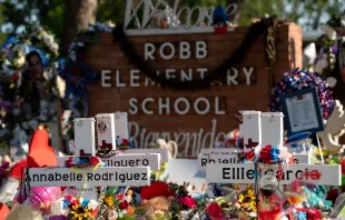 Texans on June 5, 2022, visit the memorial at Robb Elementary School dedicated to the victims of the May shooting in Uvalde, Texas. Shutterstock