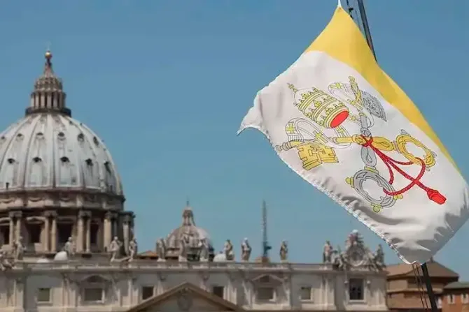 The Vatican flag and the dome of St. Peter's Basilica