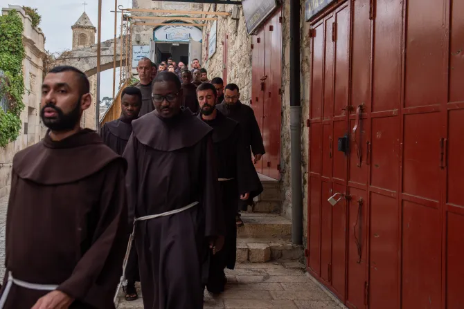 Friars walking along the Via Dolorosa