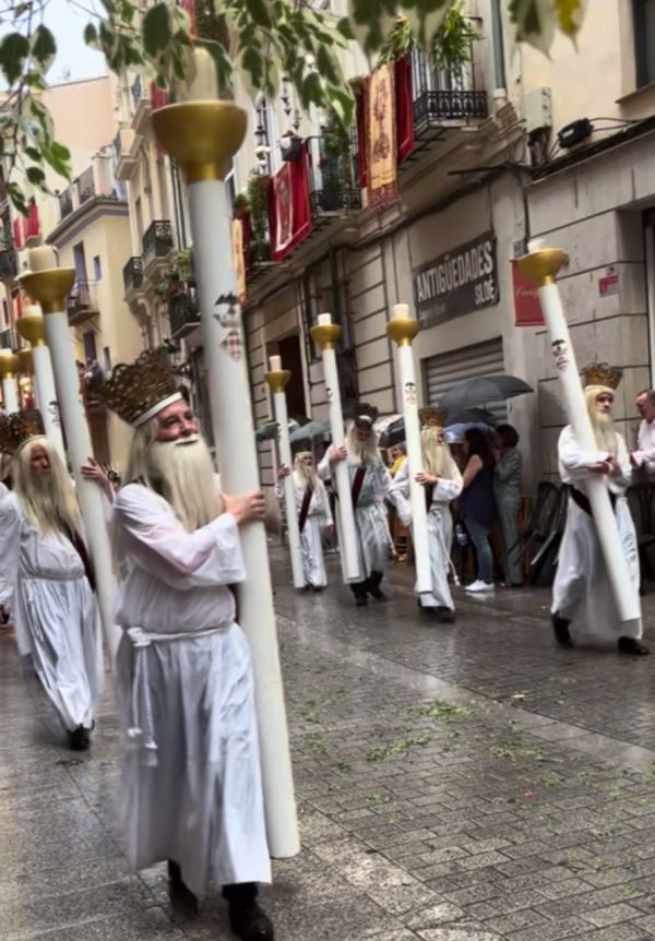 Men dressed as The Elders from the Book of Revelation carry 35 lb candles in the Corpus Christi procession in Valencia, Spain, June 11, 2023. Credit: Courtesy of Rachel Thomas