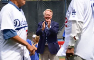 Longtime baseball broadcaster Vin Scully applauds Los Angeles Dodger hall of famers during opening day pre-game ceremonies on April 4, 2014, in Los Angeles, California. Noel Vasquez/Getty Images