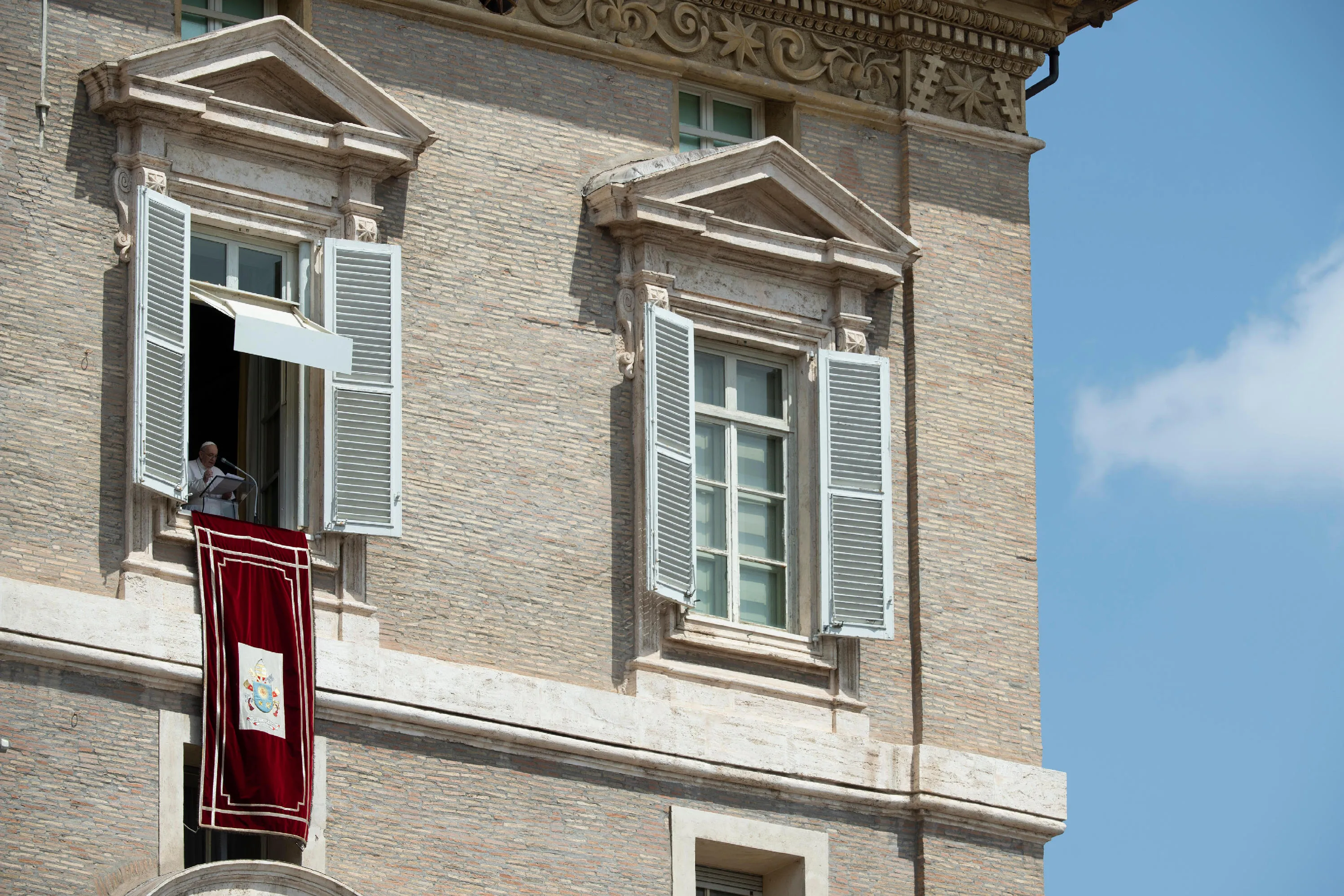 Pope Francis gives the Angelus message from a window overlooking St. Peter's Square?w=200&h=150