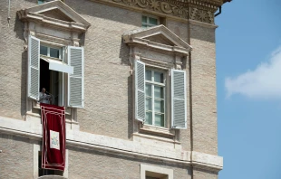 Pope Francis gives the Angelus message from a window overlooking St. Peter's Square Vatican Media