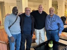 Following his release, Bishop David O'Connell (third from left) joined Father Jean Felicien, Monsignor Thomas N. Gervasio, and Monsignor Sam Sirianni at their hotel in Rome.