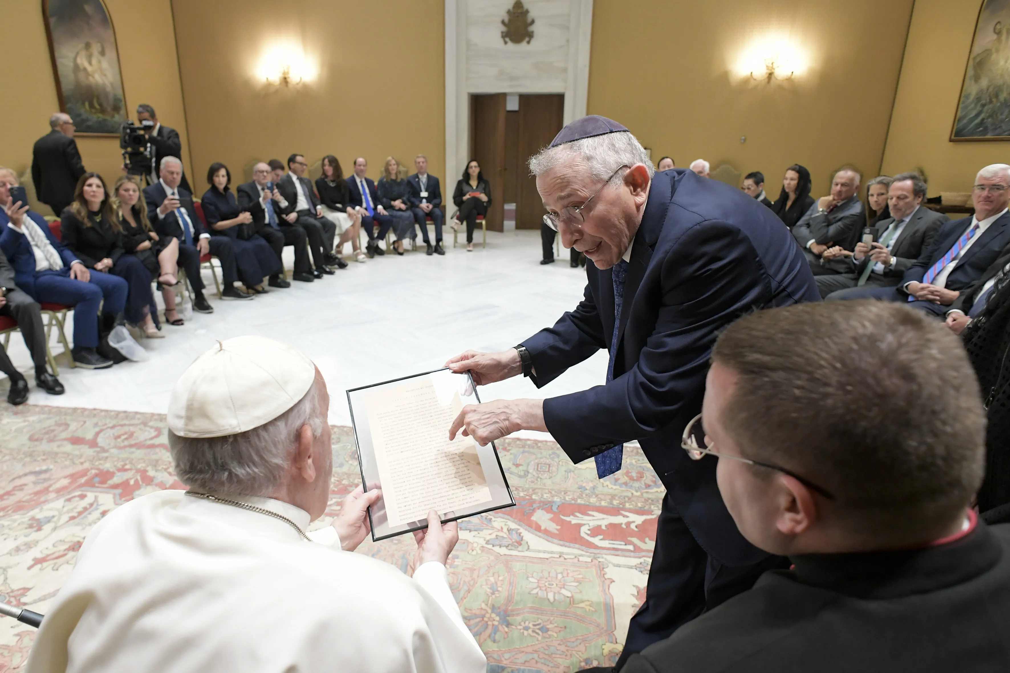 Pope Francis receives a facsimile of a 1919 letter by Adolf Hitler for the Vatican archives during an audience with a delegation of Simon Wiesenthal Center at the Vatican, June 22, 2022.?w=200&h=150