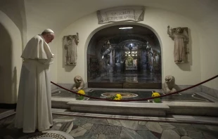 Pope Francis prays before the tombs of deceased popes in the crypt beneath St. Peter’s Basilica, Nov. 2, 2021. Vatican Media.