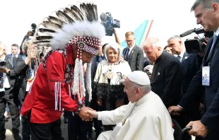 Pope Francis is greeted by a representative of Canada's indigenous peoples upon his arrival in Edmonton, Alberta, on July 24, 2022 at the start of his six-day visit to Canada. Vatican Media