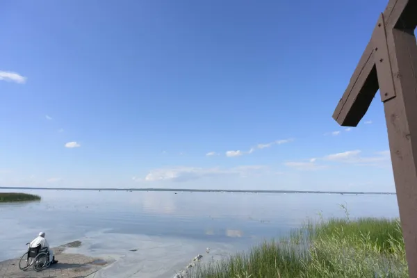 Pope Francis sits at the edge of Lac Ste. Anne, in prayer. Vatican Media