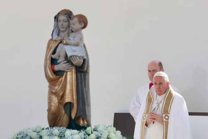 Pope Francis prays during his visit to L'Aquila, Italy on Aug. 28, 2022.