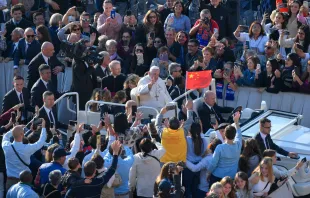 Pilgrims wave a Chinese flag at the general audience with Pope Francis, Oct. 12, 2022. Vatican Media.