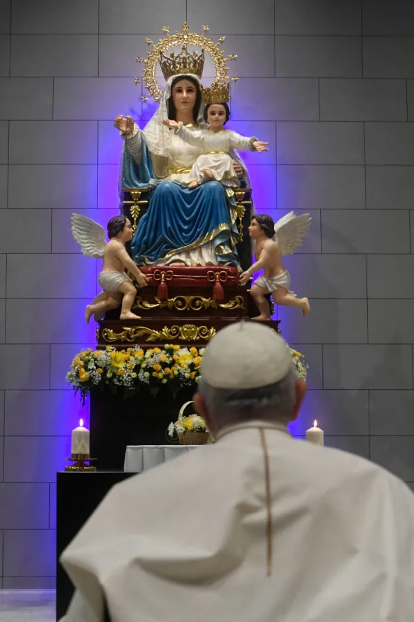 Pope Francis prays in front of the statue of Our Lady of Arabia at the Cathedral of Our Lady of Arabia on Nov. 4, 2022. Credit: Vatican Media