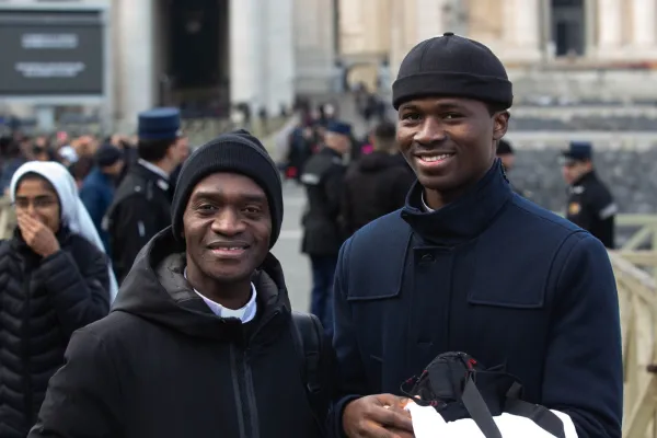 Father Anthony Agnes Adu Mensah from Accra, Ghana, (left) with a seminarian from his diocese at the funeral of Pope Benedict XVI on Jan. 5, 2023, in St. Peter's Square at the Vatican. Alan Koppschall / EWTN