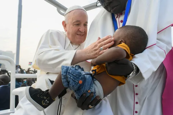 Pope Francis greets a young boy a Mass in Juba, South Sudan on Feb. 5, 2023. Vatican Media