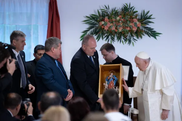 Pope Francis presents an image of Our Lady, Undoer of Knots, to staff and residents of the Blessed László Batthyány-Strattmann Institute for children and adults with visual impairments and other disabilities on April 29, 2023, in Budapest, Hungary. Daniel Ibañez/CNA