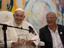 Pope Francis and José María Del Corral, president of the Scholas Occurrentes youth movement, smile during a meeting with the group's volunteers in Cascais, Portugal, on Aug. 3, 2023.