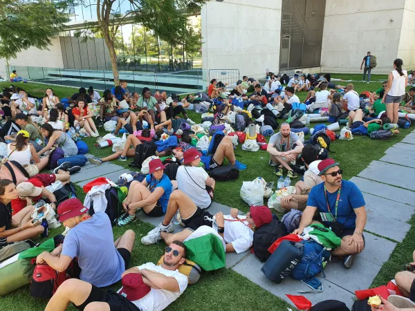 Pilgrims arrived several hours to the site of the Saturday evening vigil on Aug. 5, 2023, with Pope Francis amid warnings about high heat in Lisbon, Portugal. Hannah Brockhaus/CNA