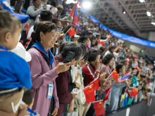 Catholics hold Chinese flags at Pope Francis' Mass in Mongolia's Steppe Arena in Ulaanbaatar on Sept. 4, 2023.