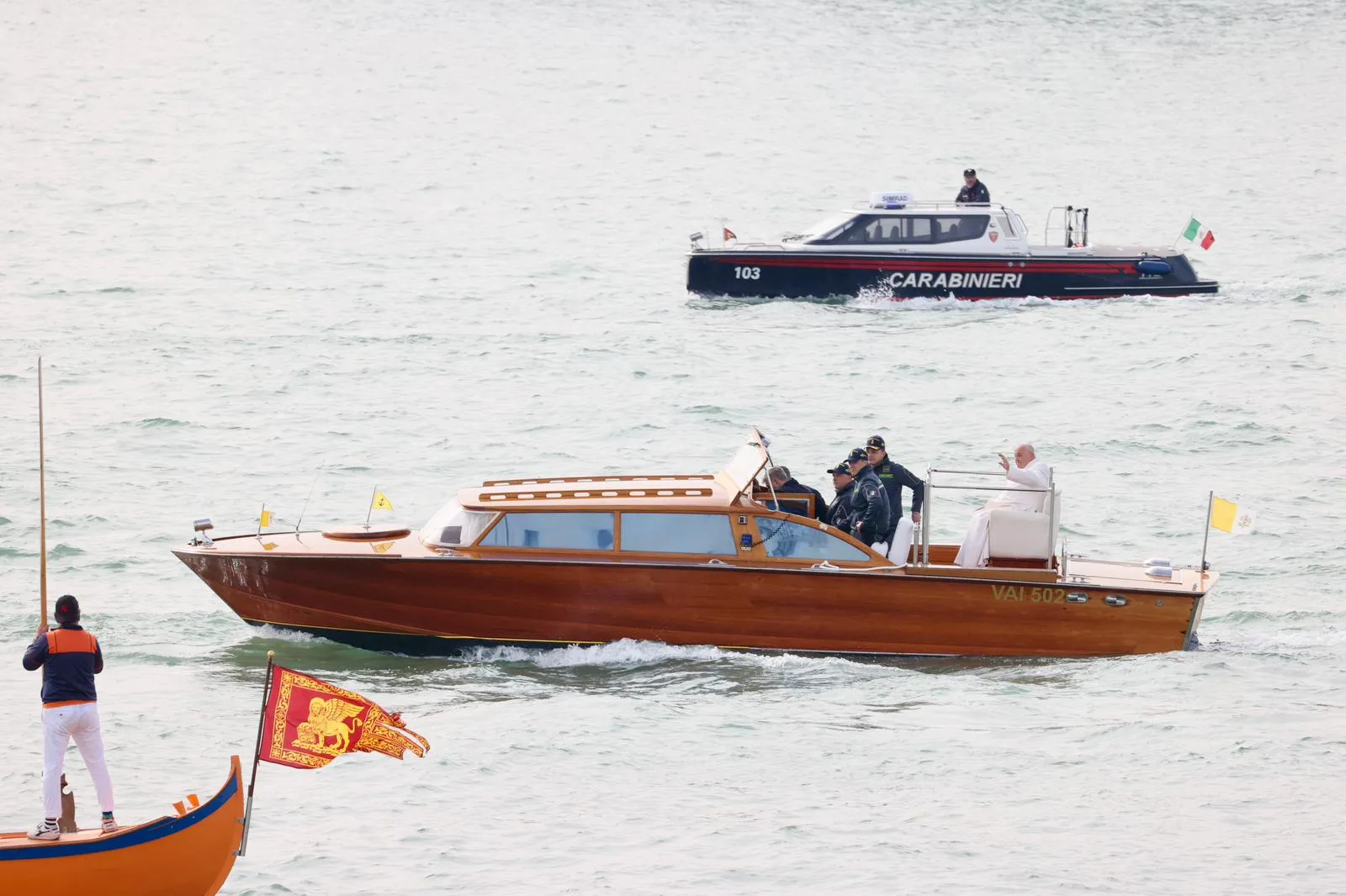 Pope Francis waves while traveling by boat in Venice, Italy, for a meeting with young people at the Basilica della Madonna della Salute on April 28, 2024. Earlier in the day he met with inmates at a women's prison.?w=200&h=150
