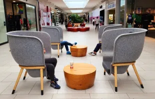 Young people use mobile devices in isolation from each other at Willowbrook Mall in Langley, British Columbia. In their pastoral letter on social media, the Canadian bishops suggest fasting from screens once a week and taking a “Technology Sabbath.” Credit: Paul Schratz