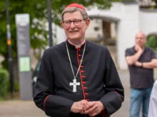 Cardinal Rainer Maria Woelki faces mounting pressure from multiple fronts, including local media — and some clergy: In open defiance, several priests conducted an event blessing same-sex couples outside the iconic Cologne Cathedral Sept 21, 2023.