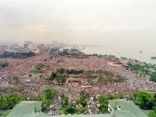 Pope John Paul II's helicopter flies over the huge crowd in Manila's Luneta Park prior to celebrating an open-air mass for an estimated two-million people gathered for the 10th World Youth Day on Jan. 15, 1995.
