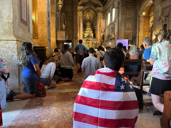 Young people kneel during adoration at the Church of Our Lady of Providence during a Rise Up Encounter of World Youth Day in Lisbon, Portugal on Aug. 4, 2023. Credit: Giulio Capece/EWTN News