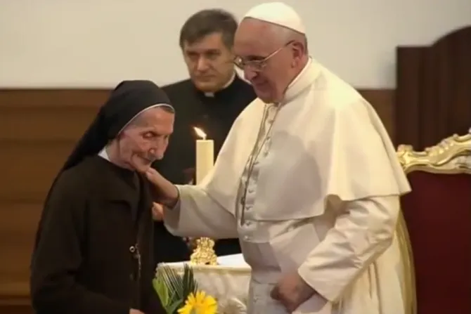 Pope Francis listens as Sister Marije Kaleta speaks in Tirana’s St. Paul Cathedral, Albania, Sunday, Sept. 21, 2014