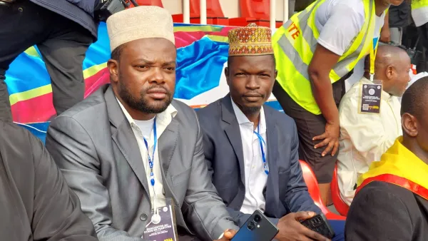 Muslim Yassine Mumbere, 35, from Butembo in eastern Congo, (R) with his friend (L) at the youth gathering with Pope Francis in Kinshasa, DRC on Feb. 2, 2023. Elias Turk/CNA